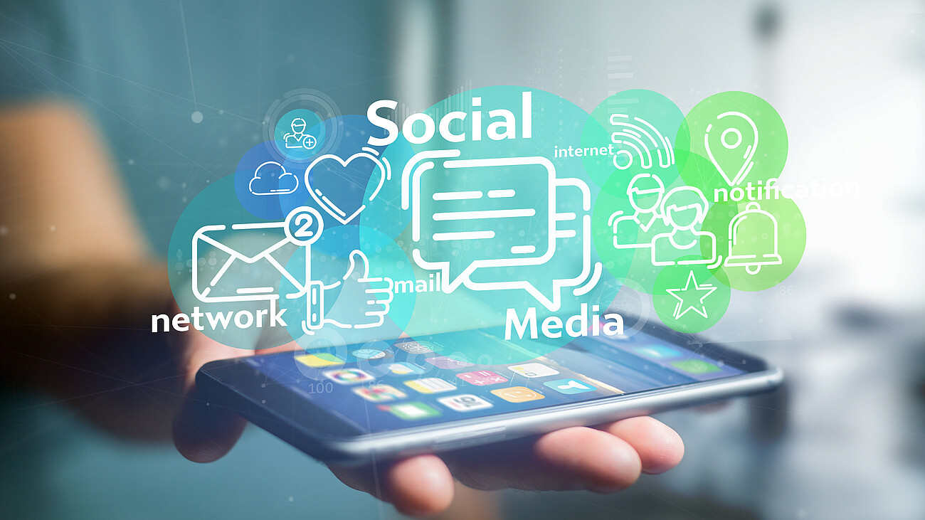 Businessman holding a cloud of social media network icon Businessman holding a cloud of social media network icon